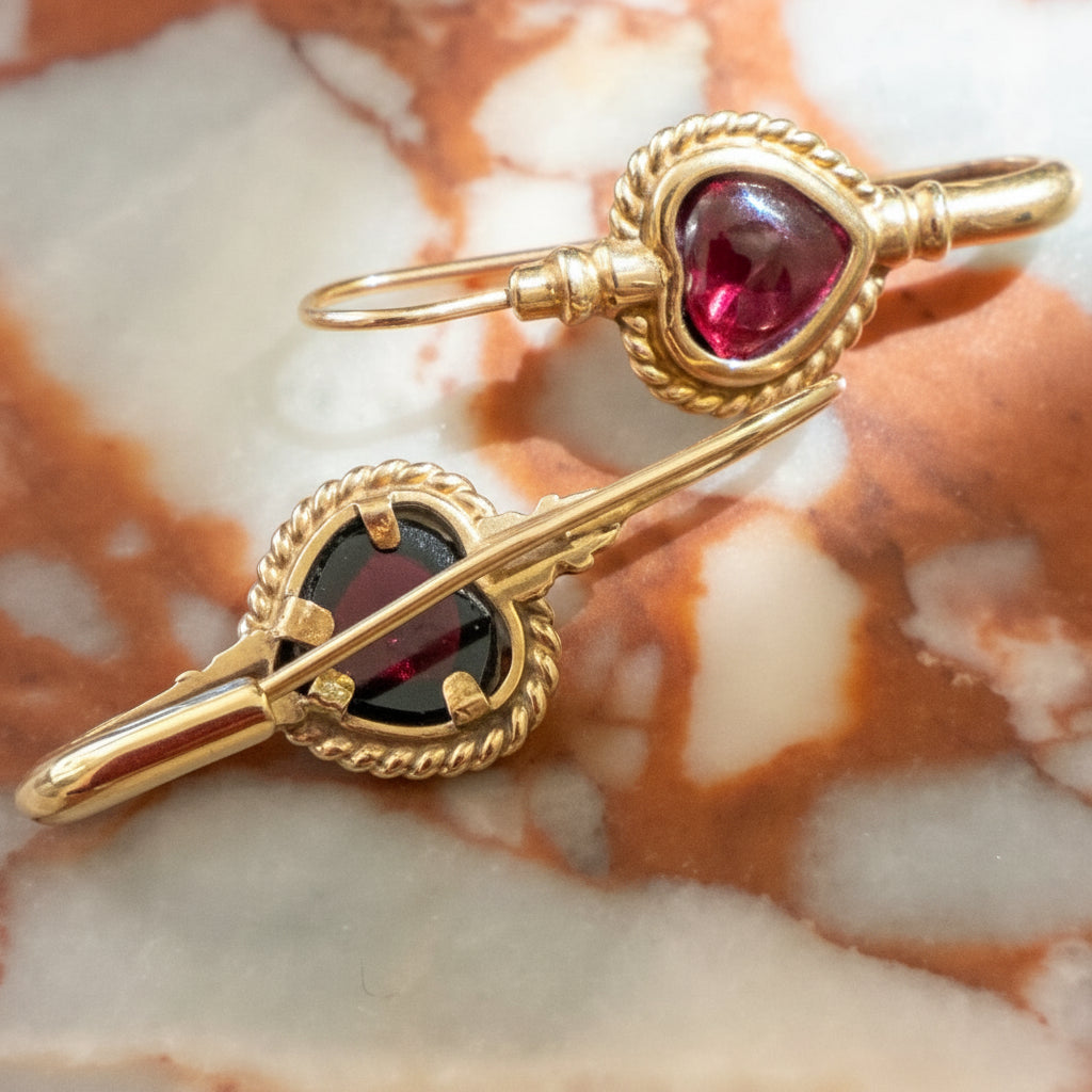 Vintage 9K earrings with bezel set cut rhodolite Garnet hearts.