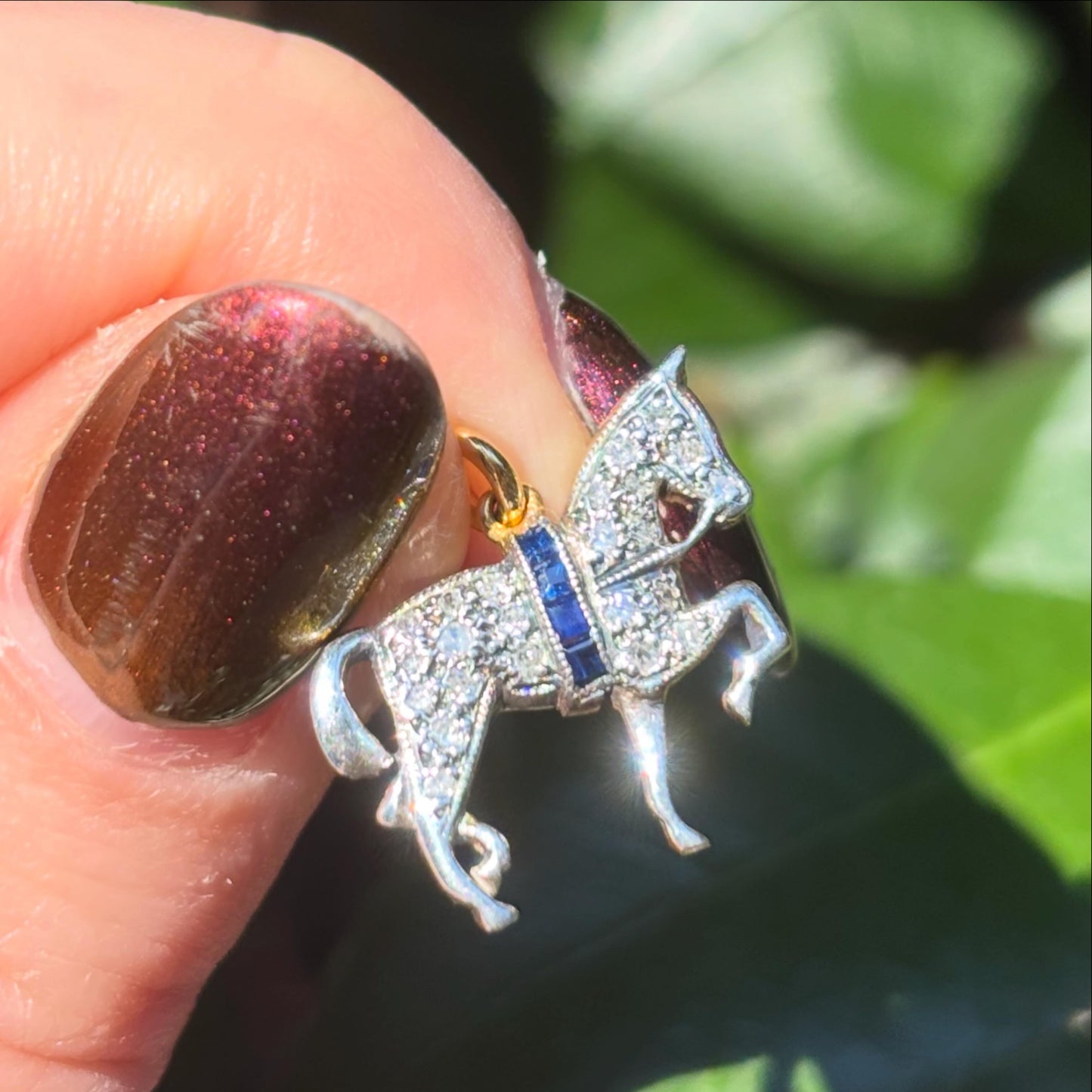 Antique style 18CT gold with silver, Sapphire and Diamond encrusted horse.