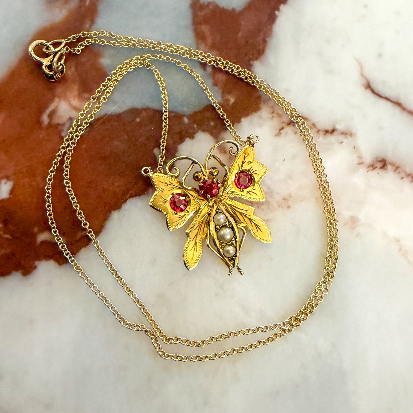 Edwardian 9CT pink paste and pearl butterfly on a Vintage fine 14K chain