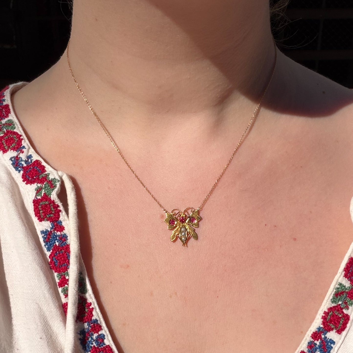 Edwardian 9CT pink paste and pearl butterfly on a Vintage fine 14K chain