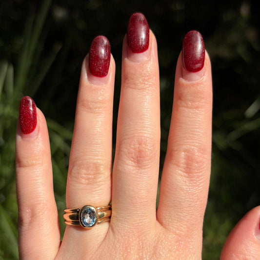 Vintage 9CT ribbed ring bezel set with an oval cut Blue Topaz