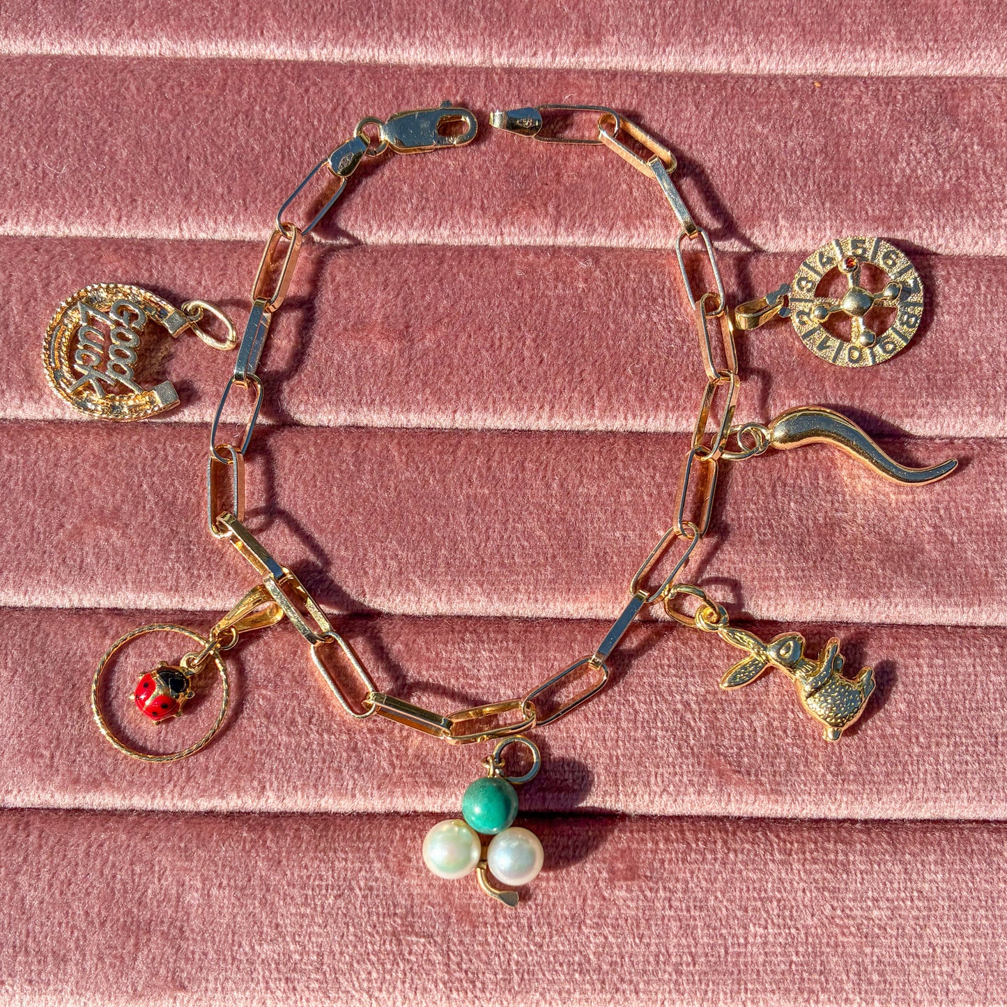 Vintage working 9CT roulette wheel charm with Garnet
