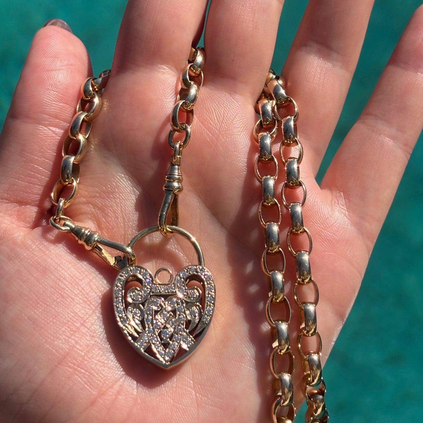 9CT yellow solid gold oval link albert chain with XL natural Diamond heart Padlock.
