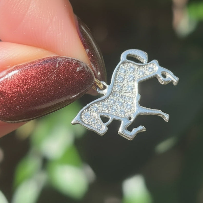 Antique style 18CT gold with silver, Sapphire and Diamond encrusted horse.